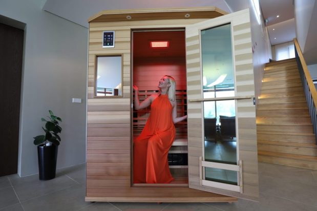 The Enrich 3 infrared sauna features a chromotherapy panel with near infrared lighting